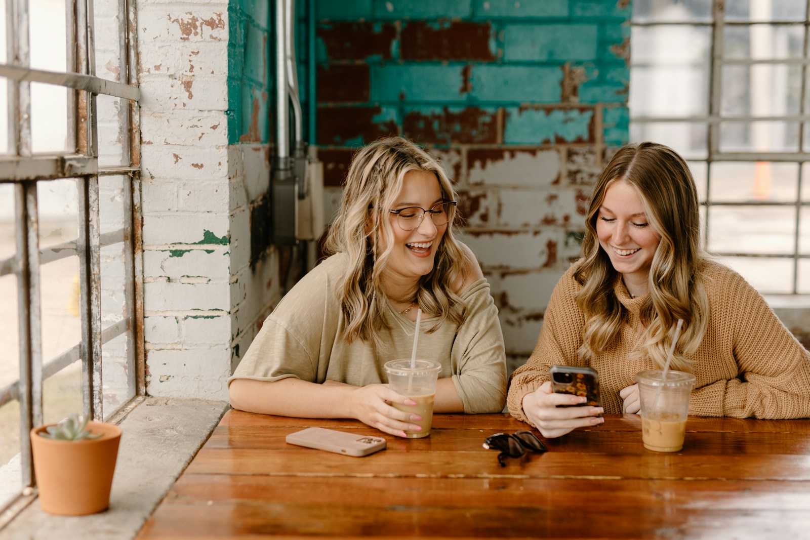 Two friends sharing a coffee-shop moment